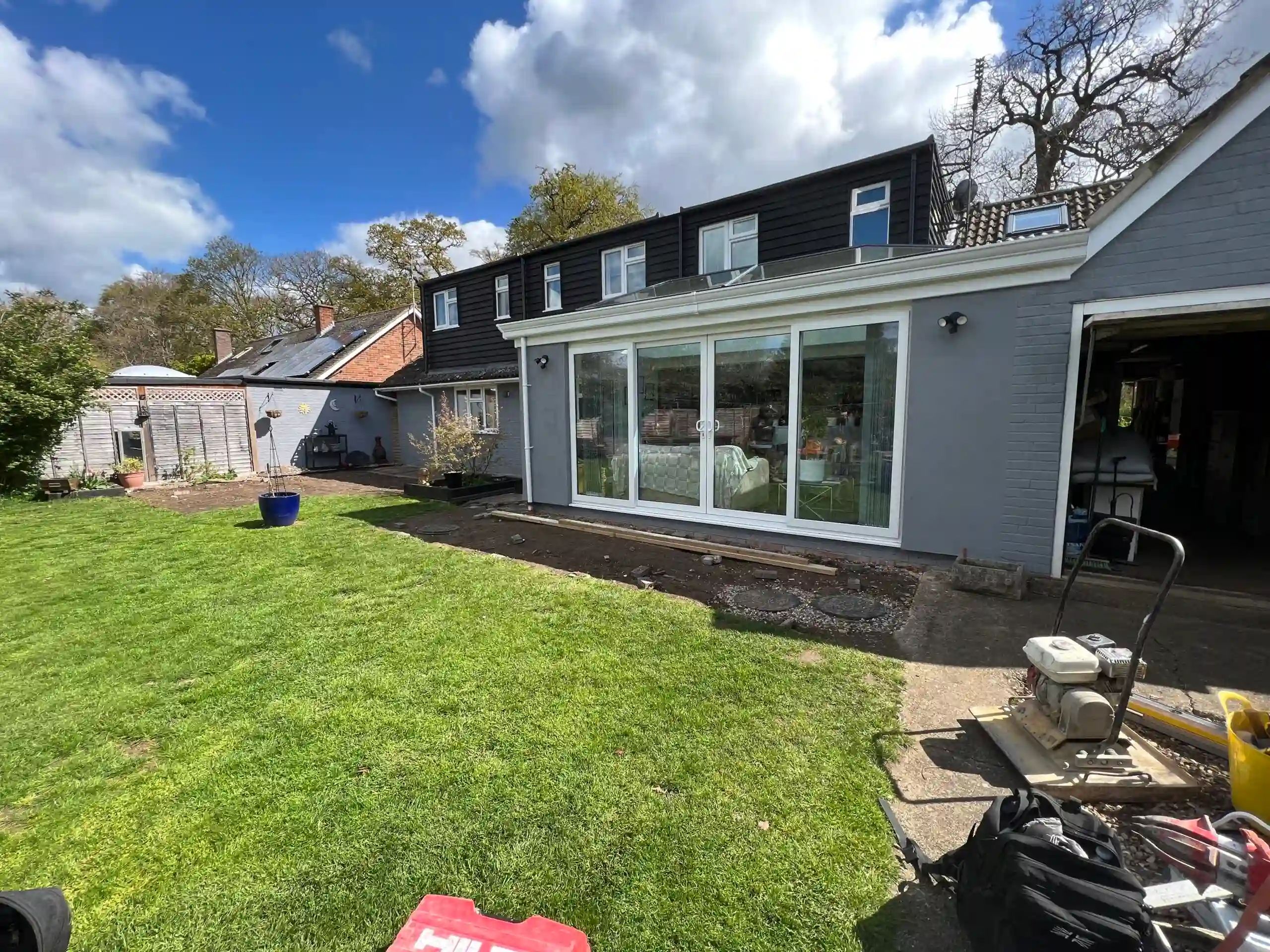 porcelain patio installation with sleepers and lights