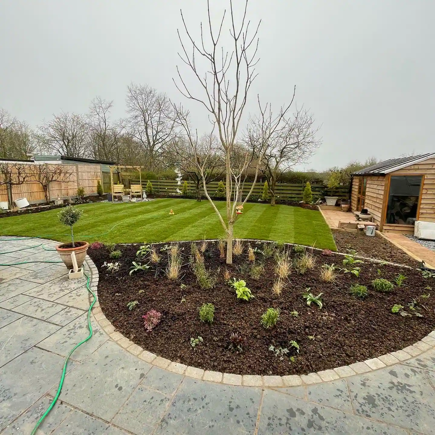 After photo of flower bed and turf installation for client