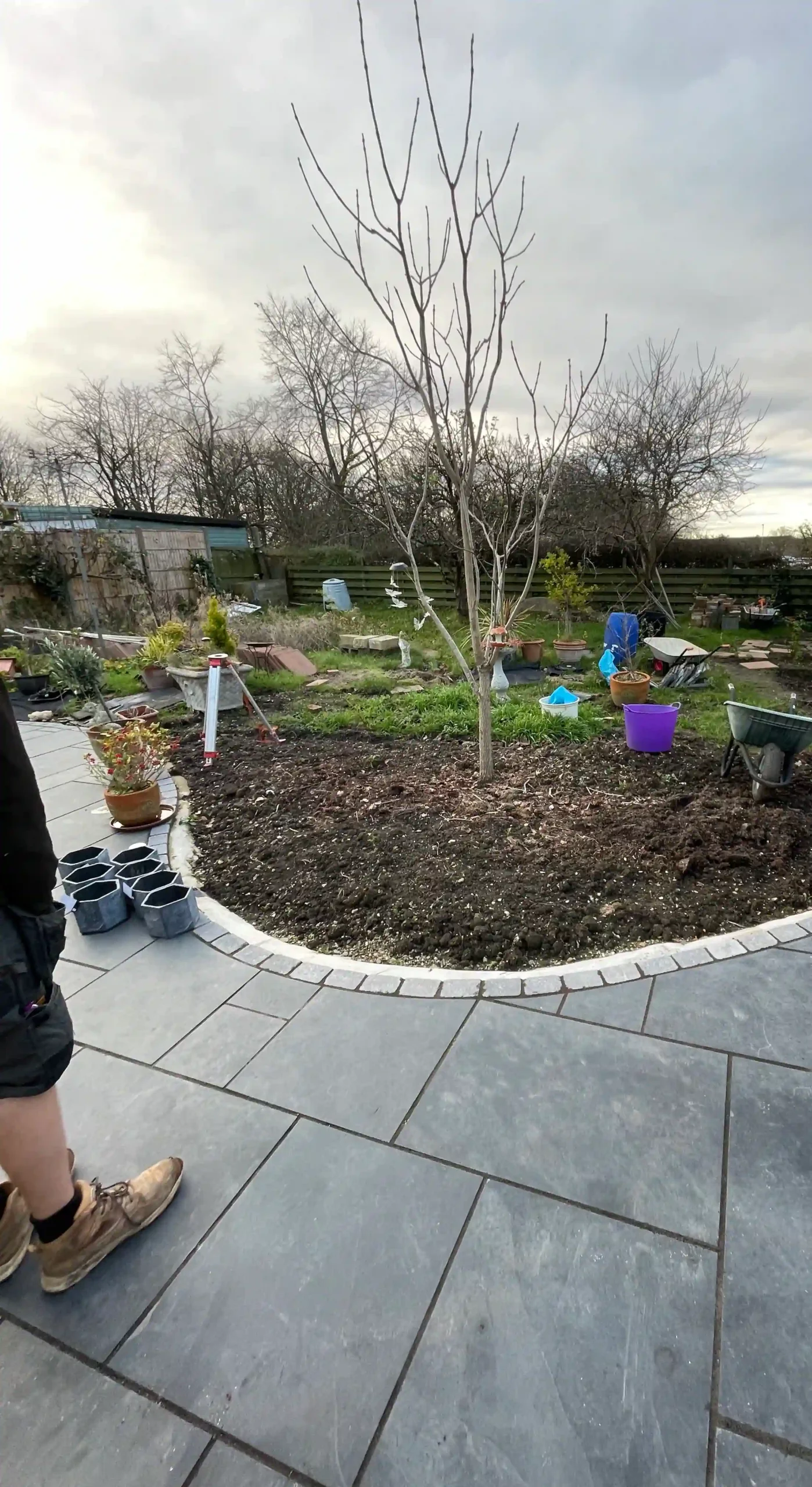 Concrete slab and flower bed installed in garden