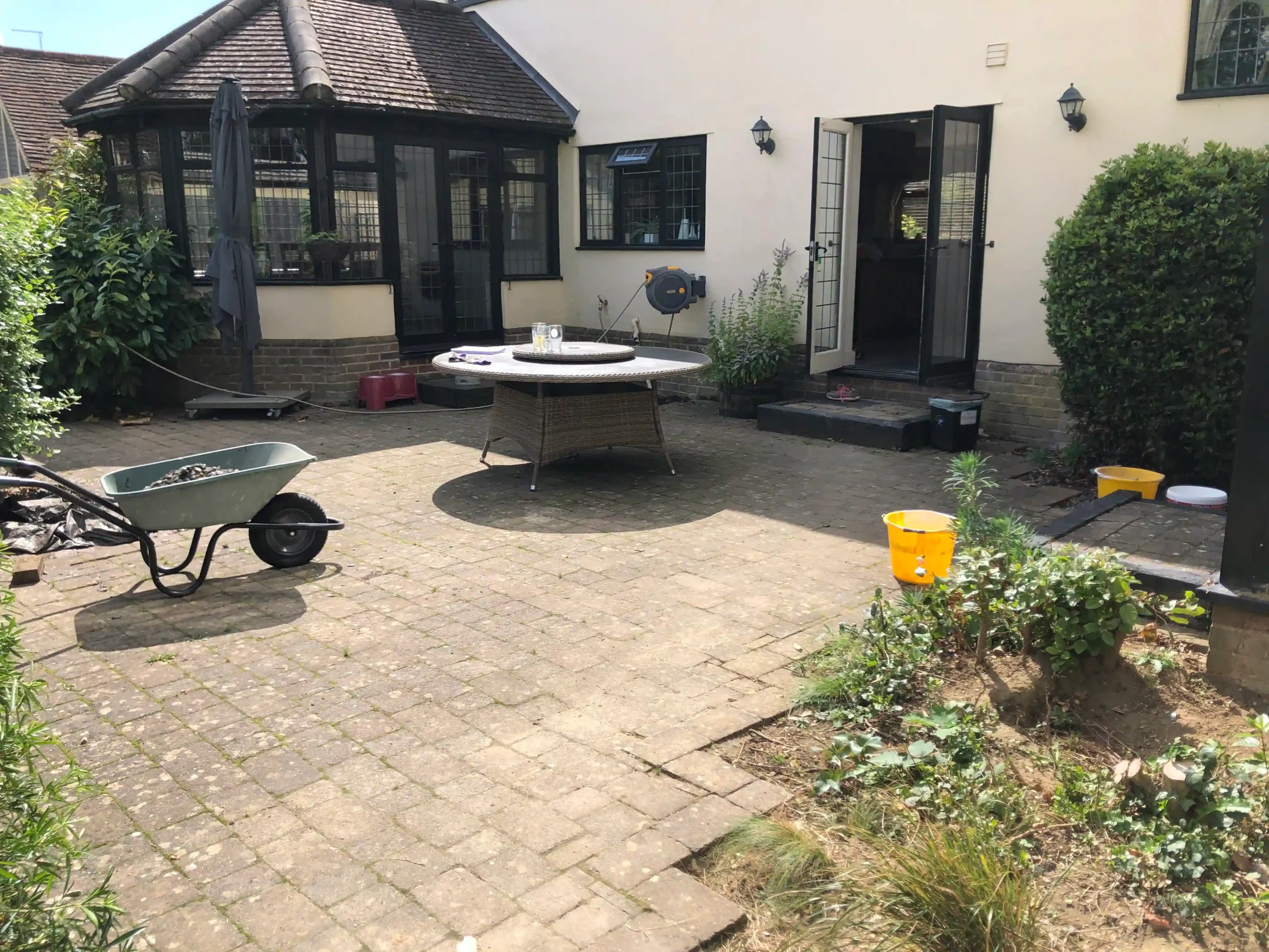 before image of client patio in garden